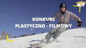 Narciarz zjezdża ze stoku- na zdjęciu napis -konkurs plstyczno- filmowy w kolorze białym